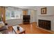 Inviting living area with a fireplace, hardwood floors, and ample seating at 7914 Yester Ct, Raleigh, NC 27615