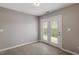 Bright room with a double glass doors opening to the outside, offering ample natural light and a seamless indoor-outdoor flow at 7914 Yester Ct, Raleigh, NC 27615