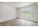 Bright and airy bedroom with two windows allowing natural light, featuring modern flooring at 804 E D St, Butner, NC 27509