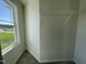 Carpeted walk-in closet with wire rack shelving and natural light from the adjacent window at 95 Tulipfield Way, Benson, NC 27504