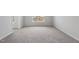 Bright, spacious bedroom features neutral carpet, light gray walls, and a large window at 96 Ripple Way # 316, Clayton, NC 27520