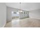 Dining area with bright natural light, sliding glass door, and modern chandelier at 96 Ripple Way # 316, Clayton, NC 27520