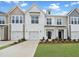 Charming townhome featuring a one-car garage, well-kept lawn, and modern architectural design at 96 Ripple Way # 316, Clayton, NC 27520