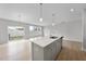 Well-lit kitchen with a kitchen island open to the dining and living area at 96 Ripple Way # 316, Clayton, NC 27520