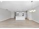 Bright and open living space with views of the kitchen and dining area at 96 Ripple Way # 316, Clayton, NC 27520