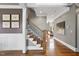 Elegant foyer features hardwood floors, a staircase with iron balusters, and wainscoting at 1001 Hazeltown Rd, Wake Forest, NC 27587