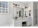 Bright bathroom featuring double sink vanity, soaking tub, and separate shower with black trim at 1006 Henny Pl, Raleigh, NC 27614
