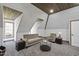 A bonus room with a vaulted ceiling, seating area, and a cozy atmosphere at 1006 Henny Pl, Raleigh, NC 27614