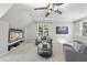 Cozy bonus room with comfortable seating, built-in shelves, and a bright window view at 1006 Henny Pl, Raleigh, NC 27614