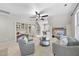 Spacious bonus room includes built-in bookshelves, hanging chair, and media center at 1006 Henny Pl, Raleigh, NC 27614