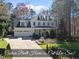 Charming two-story home with a well-manicured front yard and attached two car garage at 1006 Henny Pl, Raleigh, NC 27614