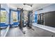 Home gym featuring a full weight rack, rubber flooring, and mirrors for fitness enthusiasts at 1006 Henny Pl, Raleigh, NC 27614