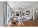 Bright living room with fireplace, large windows, hardwood flooring, and stylish decor at 1006 Henny Pl, Raleigh, NC 27614