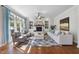 Comfortable living room with fireplace, built-in shelving, and large windows for natural light at 1006 Henny Pl, Raleigh, NC 27614