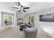 Cozy living room with neutral colors, large window, and comfortable seating at 1006 Henny Pl, Raleigh, NC 27614