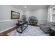 Modern office with hardwood floors, a patterned rug, and ample natural light at 1006 Henny Pl, Raleigh, NC 27614