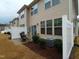 Private backyard patio area with table and chairs, partially fenced in for additional privacy at 1022 Azimuth Dr, Durham, NC 27713