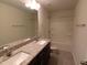 Bathroom featuring double granite vanity, neutral walls, and a shower-tub combination for convenience at 1022 Azimuth Dr, Durham, NC 27713