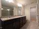 Bright bathroom featuring granite countertop with double sinks, walk-in shower, and separate water closet at 1022 Azimuth Dr, Durham, NC 27713
