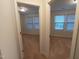 Dual doorways lead to carpeted bedrooms featuring double windows for ample sunlight at 1022 Azimuth Dr, Durham, NC 27713