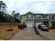 Charming two-story townhome boasts attached garages and a private driveway for convenient parking and easy access at 1022 Azimuth Dr, Durham, NC 27713