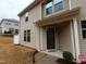 Inviting exterior of townhome with covered entryway, manicured landscaping, and a welcoming front porch at 1022 Azimuth Dr, Durham, NC 27713