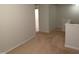 Hallway of second-floor shows carpet, white walls, and entrance to bedroom at 1022 Azimuth Dr, Durham, NC 27713