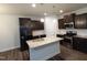 This is an image of a modern kitchen with stainless steel appliances and a center island at 1022 Azimuth Dr, Durham, NC 27713