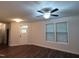 Inviting living room features modern ceiling fan and natural light from the front door and large windows at 1022 Azimuth Dr, Durham, NC 27713