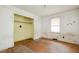 Empty bedroom featuring hardwood floors and a closet, awaiting personalization and upgrades at 1066 Shuford Rd, Wake Forest, NC 27587