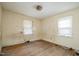 Sunlit bedroom with hardwood floors and windows, ready for a fresh makeover at 1066 Shuford Rd, Wake Forest, NC 27587