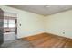 Empty bedroom with wood floors, yellow walls and doorway to the kitchen at 1066 Shuford Rd, Wake Forest, NC 27587
