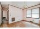 View of dining room featuring peeling wallpaper, a window, and outdated lighting at 1066 Shuford Rd, Wake Forest, NC 27587
