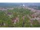 Secluded estate with a brick house nestled amidst dense trees and greenery with views of the adjacent water at 10726 Trego Trl, Raleigh, NC 27614