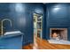 Stylish bar area with marble countertop and a cozy fireplace at 10726 Trego Trl, Raleigh, NC 27614