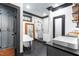 Bright bathroom featuring a clawfoot tub, modern shower, and elegant black and white design at 10726 Trego Trl, Raleigh, NC 27614