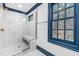 Modern bathroom features a glass-enclosed shower with marble tile and a built-in bench at 10726 Trego Trl, Raleigh, NC 27614
