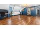 Spacious bedroom features beautiful hardwood floors, custom blue built-in cabinets and modern chandelier at 10726 Trego Trl, Raleigh, NC 27614