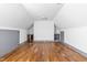Spacious bonus room features hardwood floors, modern lighting and custom gray cabinets with built-in refrigerator at 10726 Trego Trl, Raleigh, NC 27614