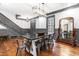 Bright dining room with hardwood floors, modern light fixture and gray accents at 10726 Trego Trl, Raleigh, NC 27614