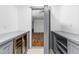 View through gray-trimmed doorway into a spacious room with hardwood floors and modern lighting at 10726 Trego Trl, Raleigh, NC 27614