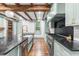 Well-appointed kitchen boasts stainless steel appliances and black countertops at 10726 Trego Trl, Raleigh, NC 27614