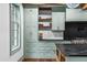 Custom kitchen boasts unique cabinetry, shelving, and stainless appliances at 10726 Trego Trl, Raleigh, NC 27614