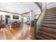 Open floor plan featuring dining area, staircase, and living space with hardwood floors at 10726 Trego Trl, Raleigh, NC 27614