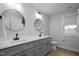 Bathroom featuring a double vanity, round mirrors, and modern fixtures at 1105 Massey St, Smithfield, NC 27577