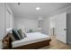 Inviting bedroom with a comfortable bed, storage, and bright light at 1105 Massey St, Smithfield, NC 27577
