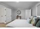 Bedroom with bed, side tables, and ample natural light from two windows with light-blocking shades at 1105 Massey St, Smithfield, NC 27577