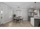 Open-concept dining area with stainless steel appliances and designer lighting at 1105 Massey St, Smithfield, NC 27577