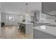 Modern kitchen featuring gray cabinets, a central island, and stainless-steel appliances at 1105 Massey St, Smithfield, NC 27577