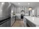 Open kitchen features a stainless refrigerator, center island, and modern appliances at 1105 Massey St, Smithfield, NC 27577